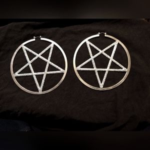 Silver colored pentagram earrings